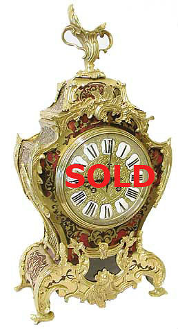 Mantel Clocks . Large red boulle sold